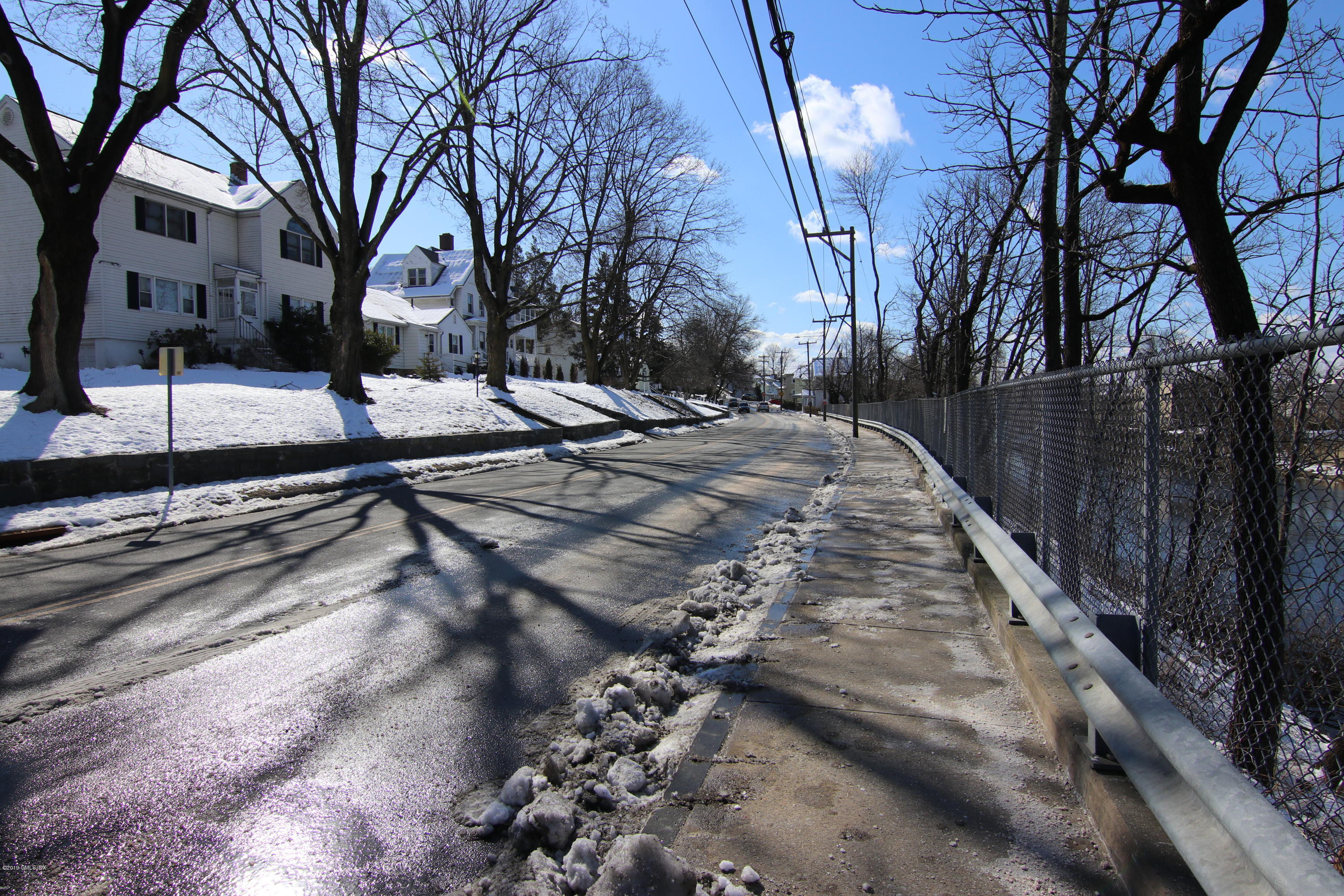 21 Byram Road Greenwich, CT 06830 - Photo 52 of 53 a view of a yard with snow on both side
