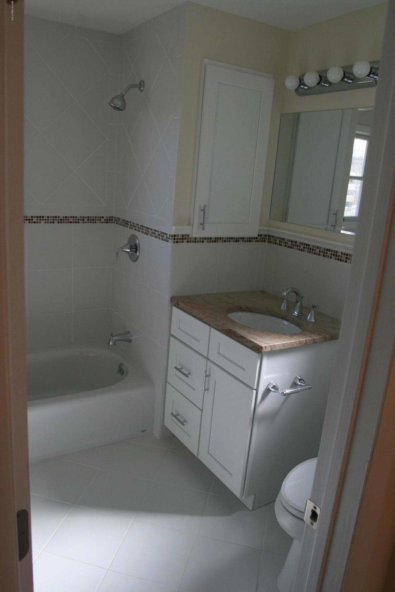 21 Byram Road Greenwich, CT 06830 - Photo 7 of 53 a bathroom with a sink a toilet and shower