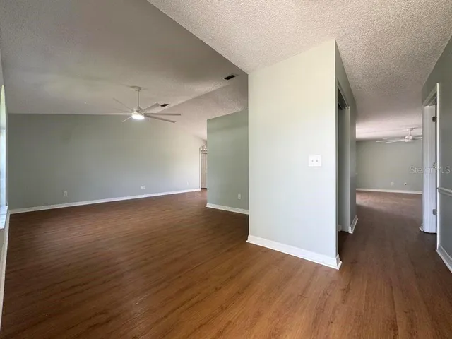 an empty room with wooden floor