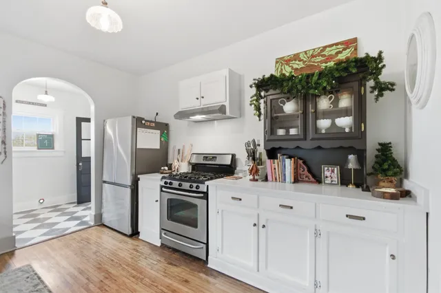 a view of hallway with stairs and wooden floor