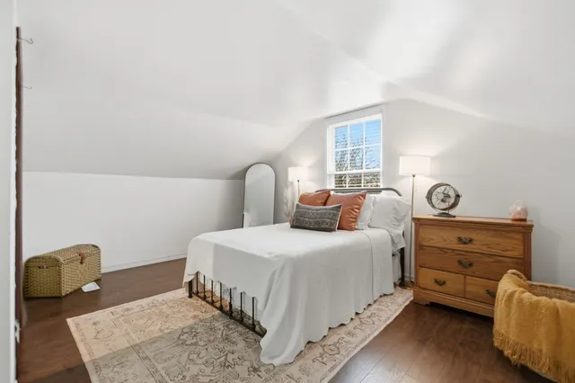 a view of a wooden house with a yard