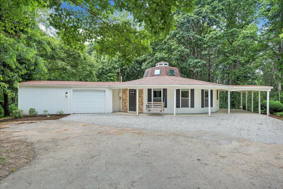 1902 Webbs Mill Road North Floyd, VA 24091 - Photo 1 of 30 a front view of a house with a garden