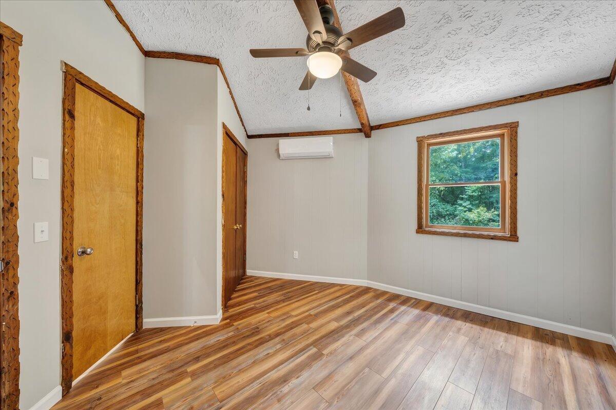 1902 Webbs Mill Road North Floyd, VA 24091 - Photo 13 of 30 wooden floor in an empty room with a window