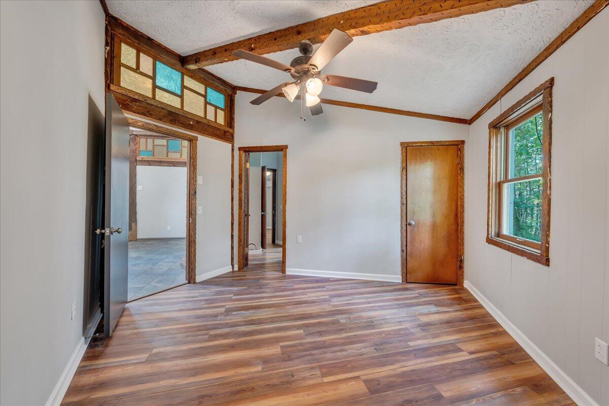 1902 Webbs Mill Road North Floyd, VA 24091 - Photo 15 of 30 a view of a hallway with a window and wooden floor