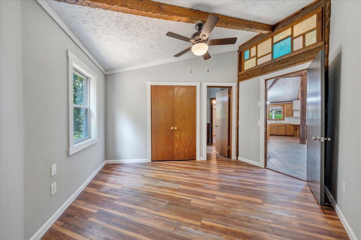 1902 Webbs Mill Road North Floyd, VA 24091 - Photo 18 of 30 a view of a hallway with wooden floor and staircase