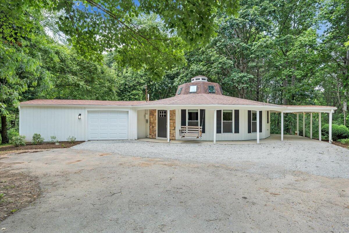 1902 Webbs Mill Road North Floyd, VA 24091 - Photo 2 of 30 a front view of a house with a garden