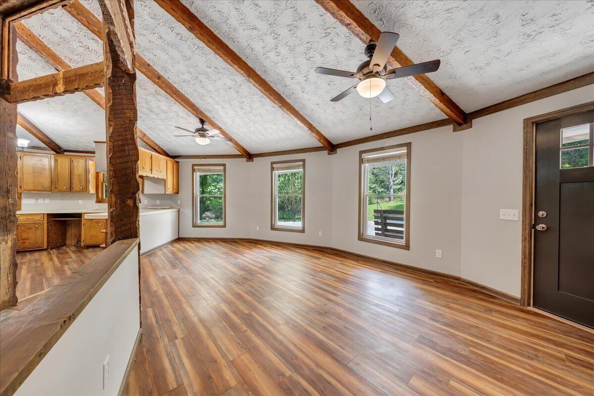 1902 Webbs Mill Road North Floyd, VA 24091 - Photo 21 of 30 a view of an empty room with wooden floor and a window