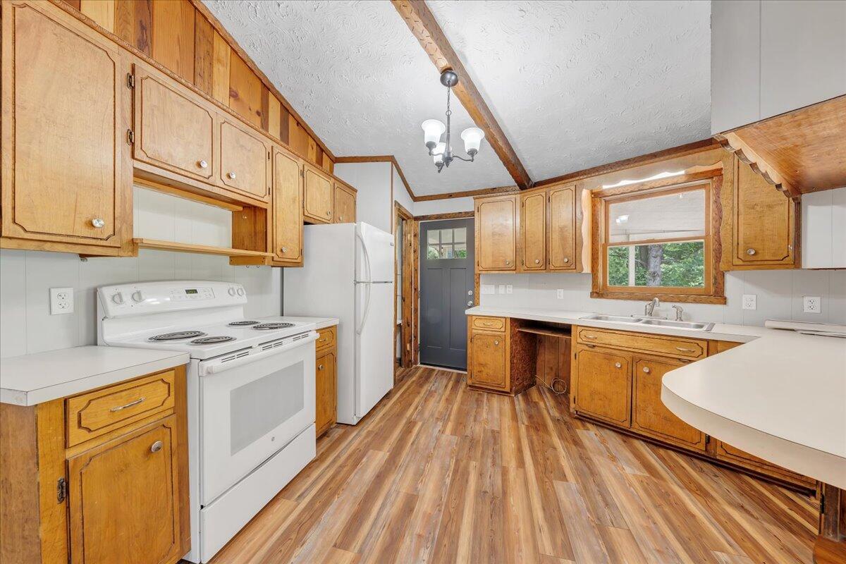 1902 Webbs Mill Road North Floyd, VA 24091 - Photo 27 of 30 a kitchen with stainless steel appliances granite countertop a sink stove and refrigerator