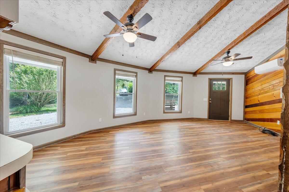 1902 Webbs Mill Road North Floyd, VA 24091 - Photo 28 of 30 a view of an empty room with a window and wooden floor