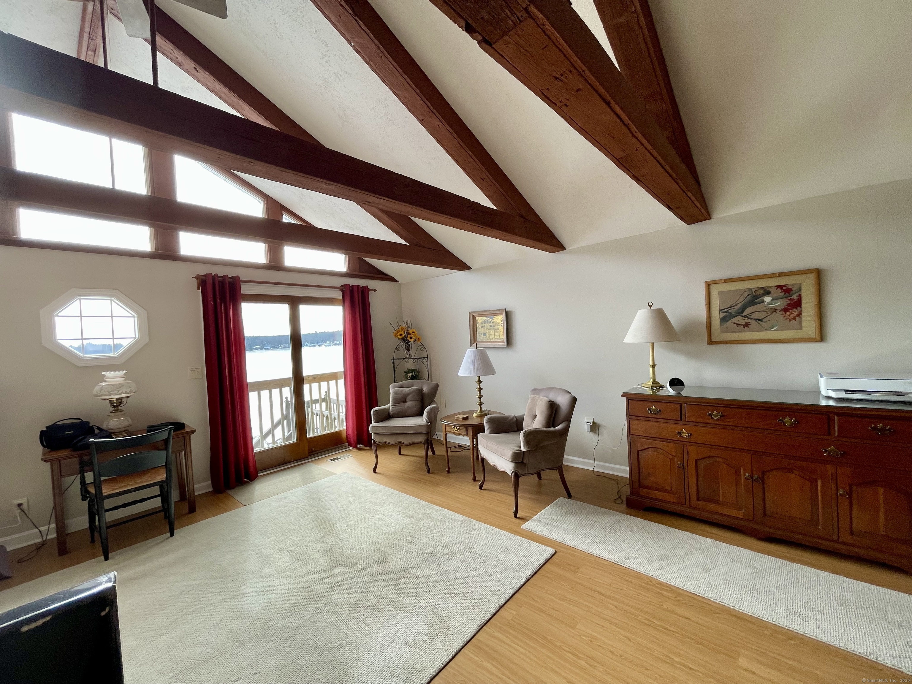 203 Pine Hollow Road Killingly, CT 06241 - Photo 11 of 33 a living room with furniture fireplace and a large window