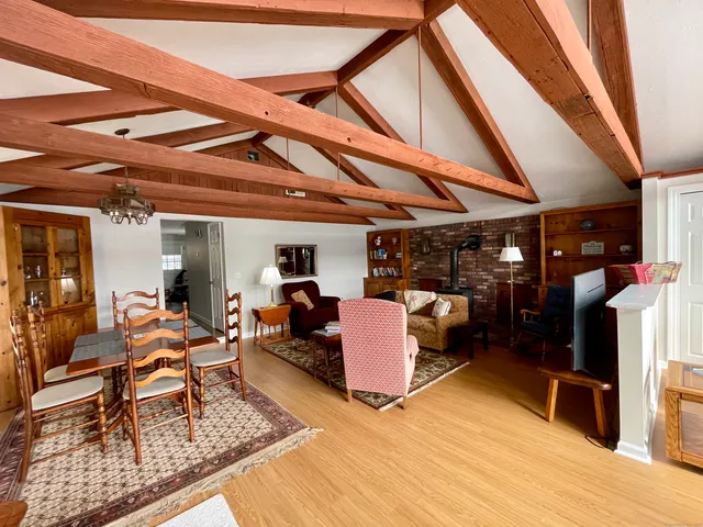 a view of a roof deck with wooden floor and fence