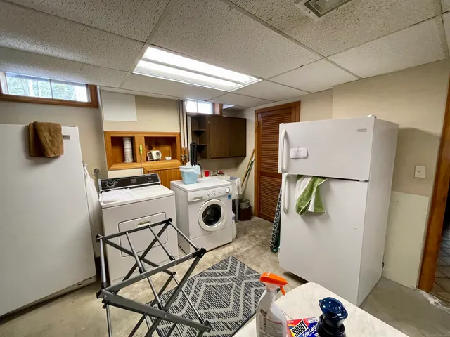 a view of a backyard with plants and lake view