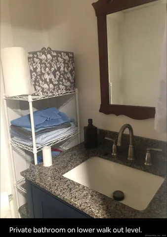 a bedroom with two beds and a night stand