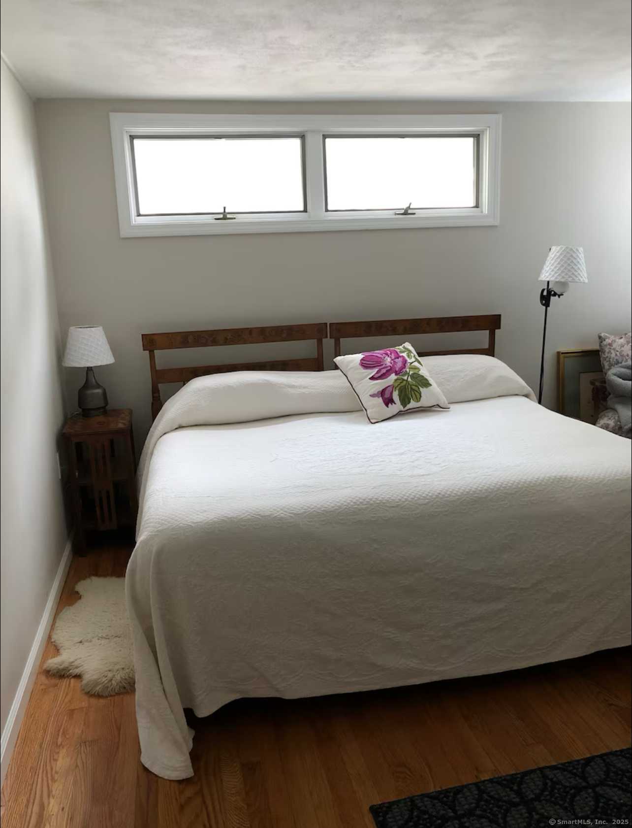 203 Pine Hollow Road Killingly, CT 06241 - Photo 30 of 33 a bedroom with a bed and wooden floor