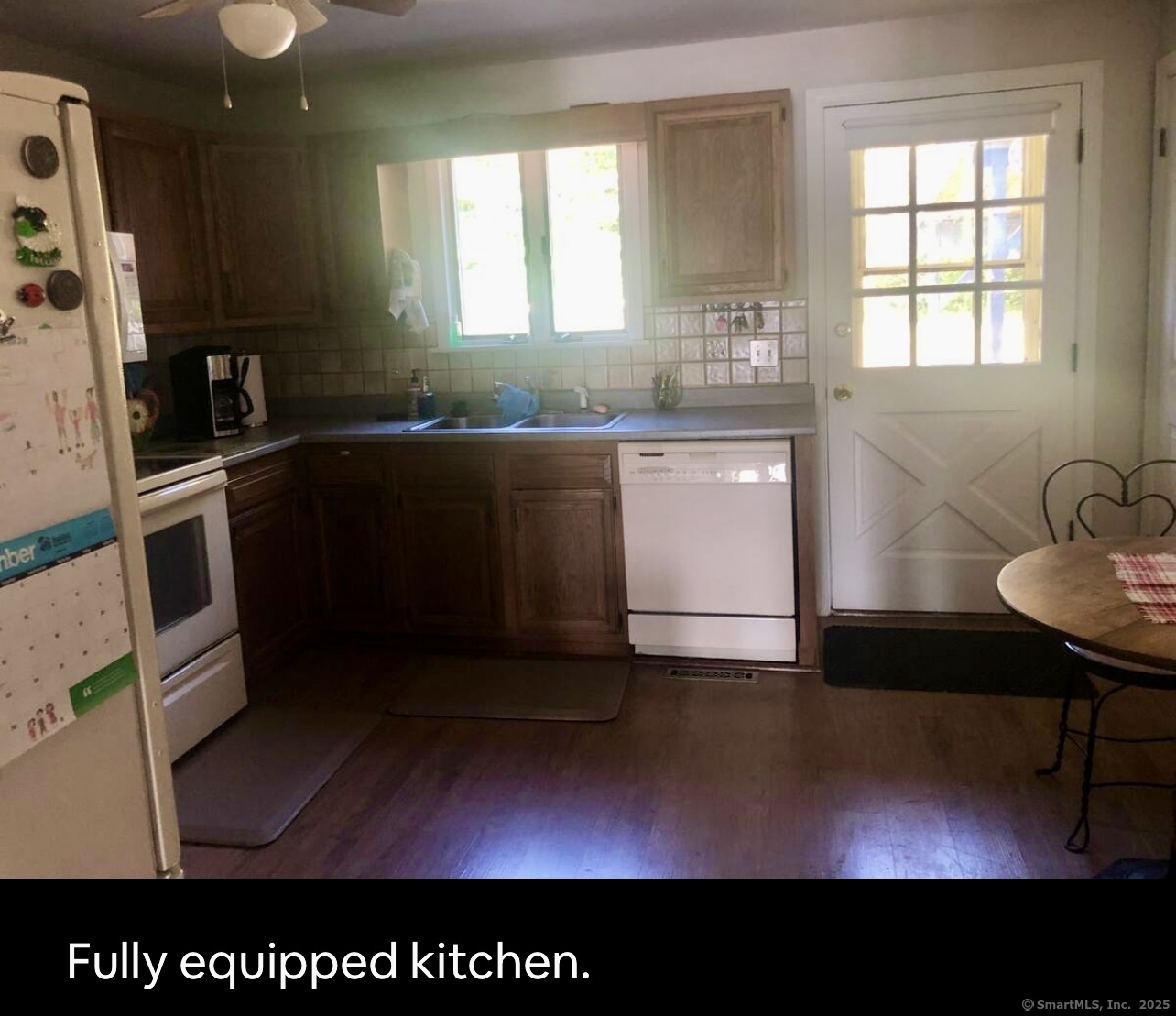 203 Pine Hollow Road Killingly, CT 06241 - Photo 33 of 33 a kitchen with granite countertop a stove a sink and a window