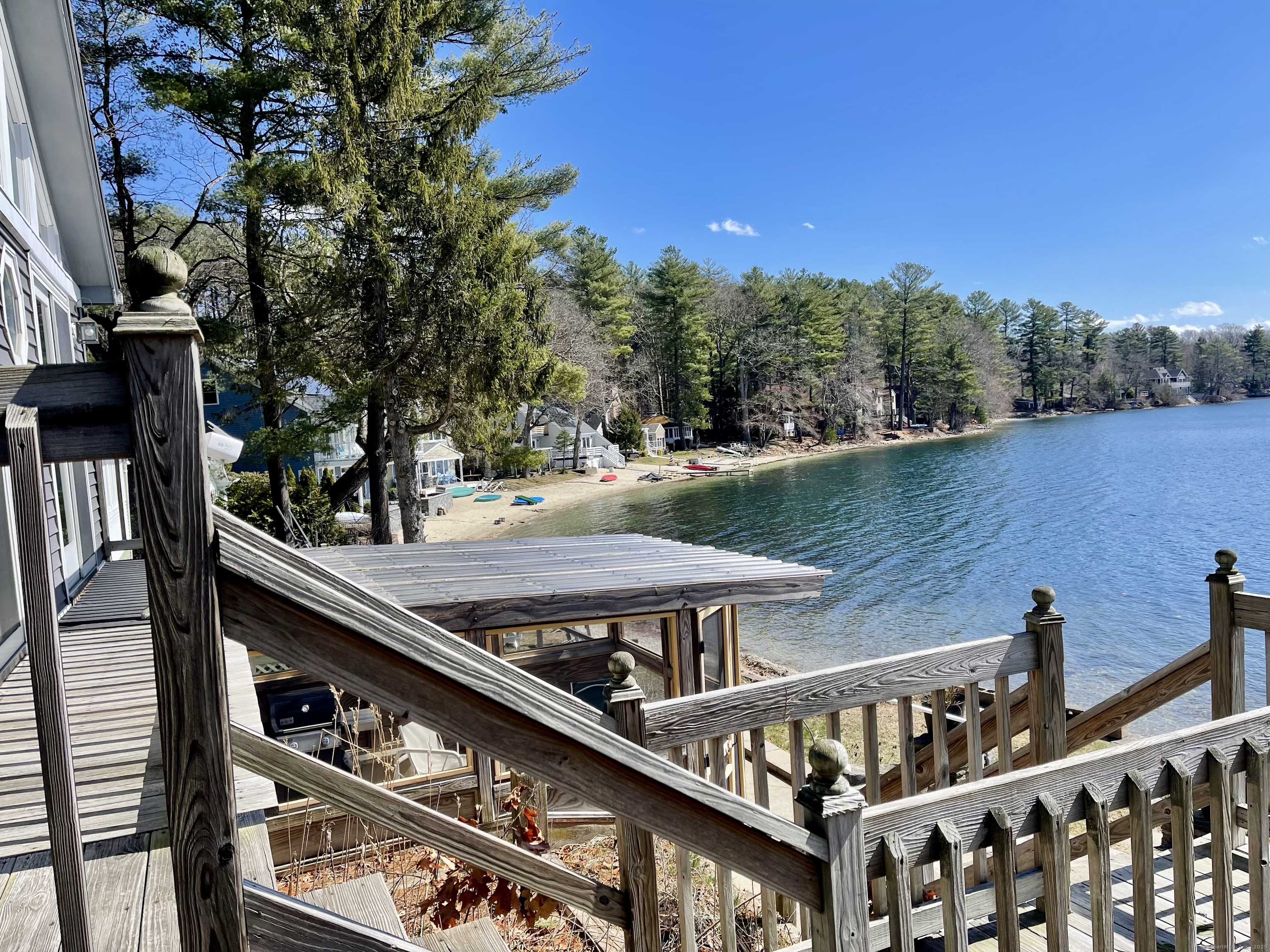 203 Pine Hollow Road Killingly, CT 06241 - Photo 6 of 33 a view of a roof deck with table and chairs with wooden floor and fence