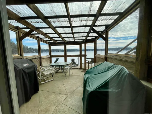 a living room with furniture gym equipment and a table