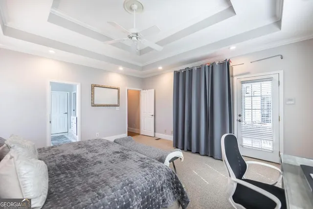 a view of a livingroom with furniture and a large window