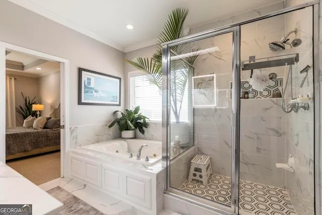 a bathroom with a tub shower and mirror