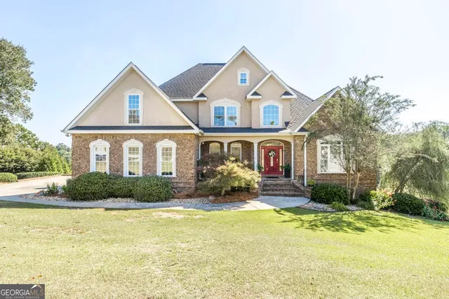 a front view of a house with a yard