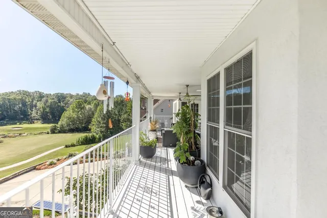 a view of balcony with furniture
