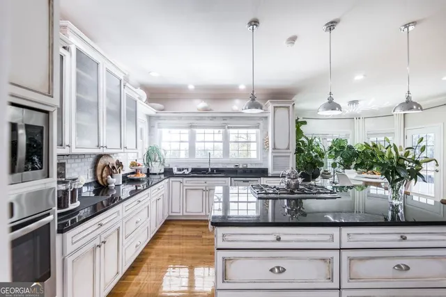 a kitchen with counter top space and appliances