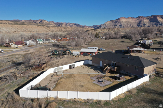2095 West 4100 North Spring Glen, UT 84526 - Photo 30 of 35 Aerial view of residential area featuring a mountain backdrop