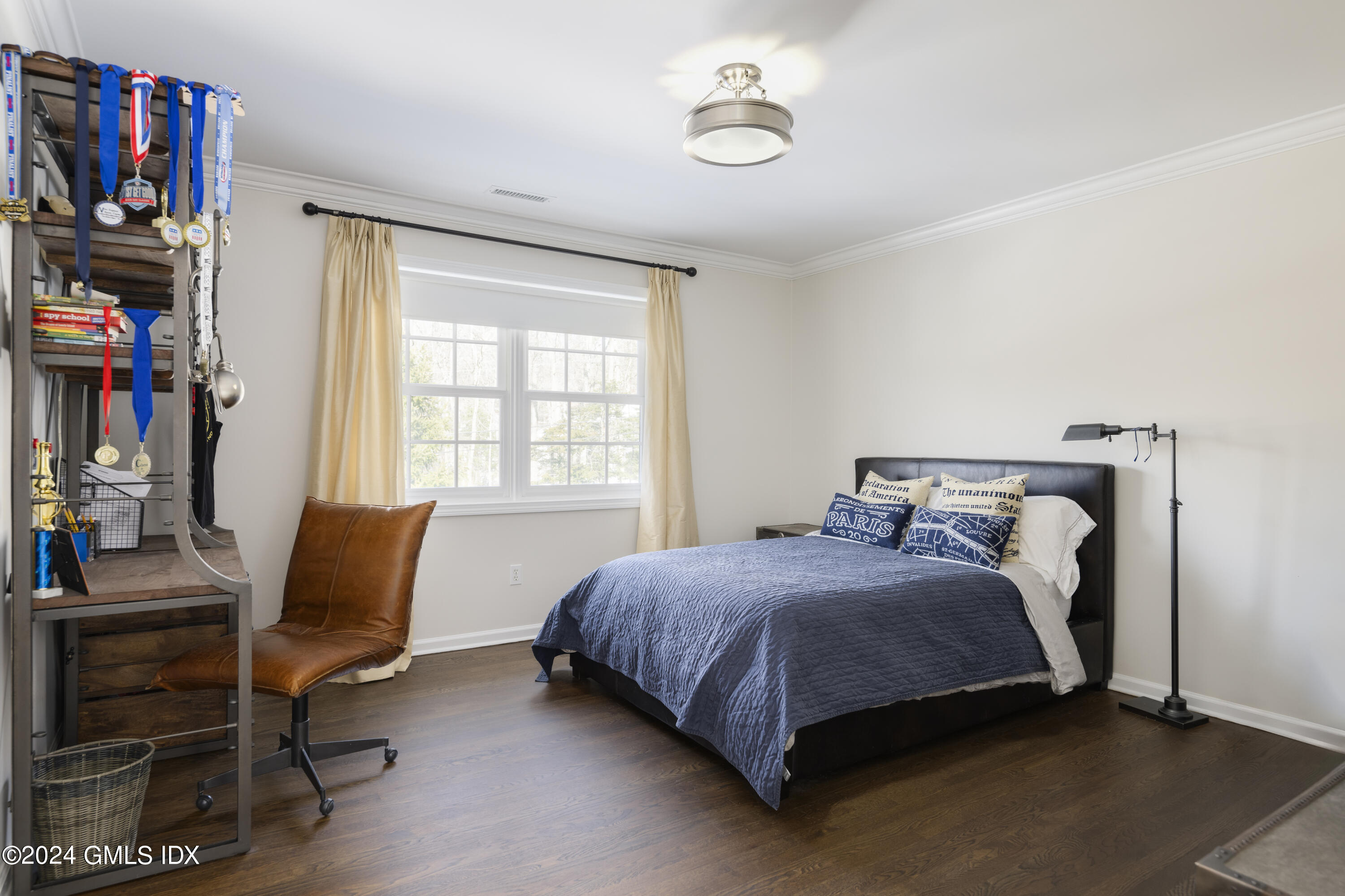 17 Rustic View Road Greenwich, CT 06830 - Photo 17 of 26 a bedroom with a bed and a chair