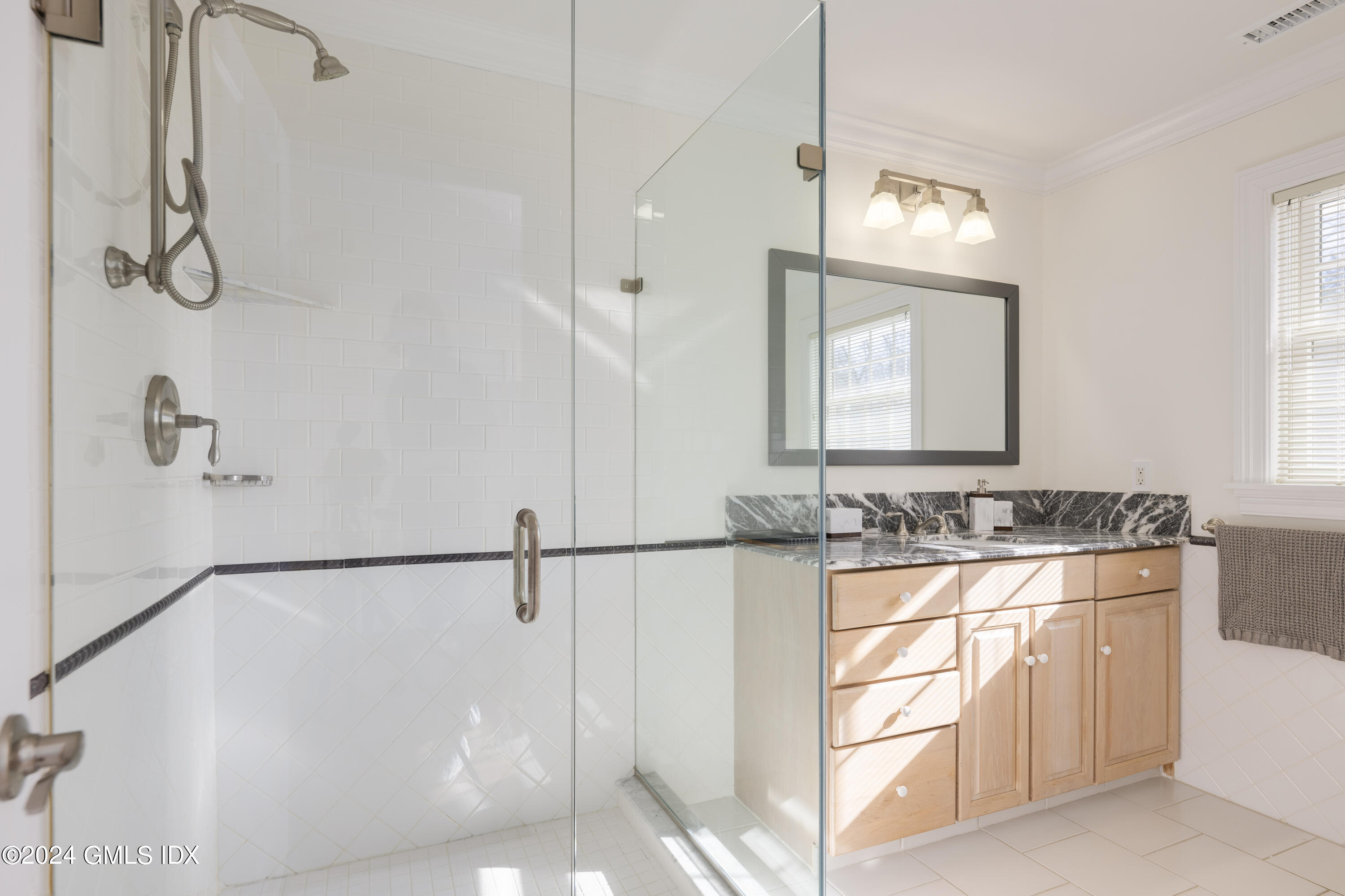 17 Rustic View Road Greenwich, CT 06830 - Photo 20 of 26 a bathroom with a sink and a mirror