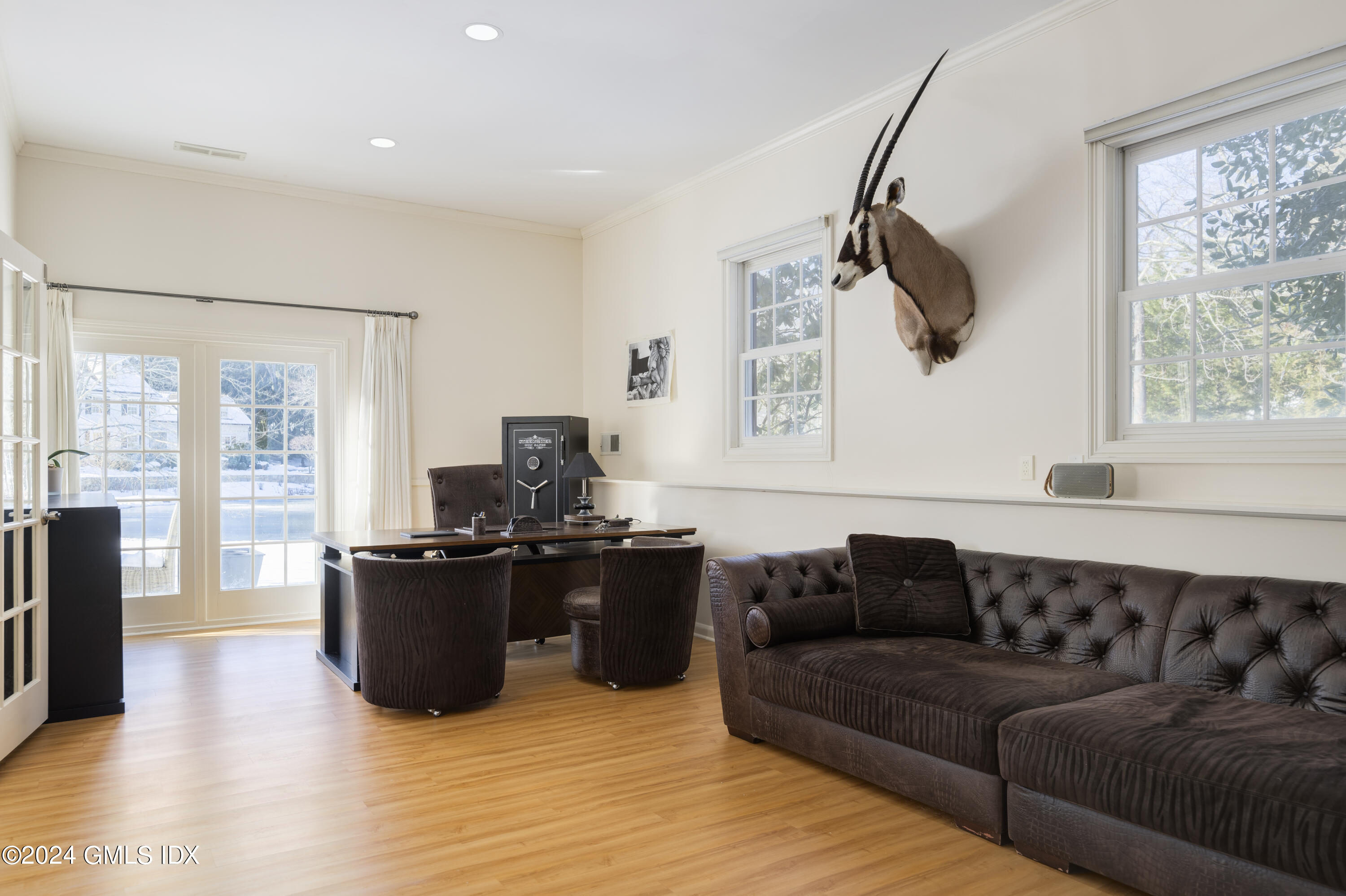 17 Rustic View Road Greenwich, CT 06830 - Photo 22 of 26 a living room with furniture window and a flat screen tv