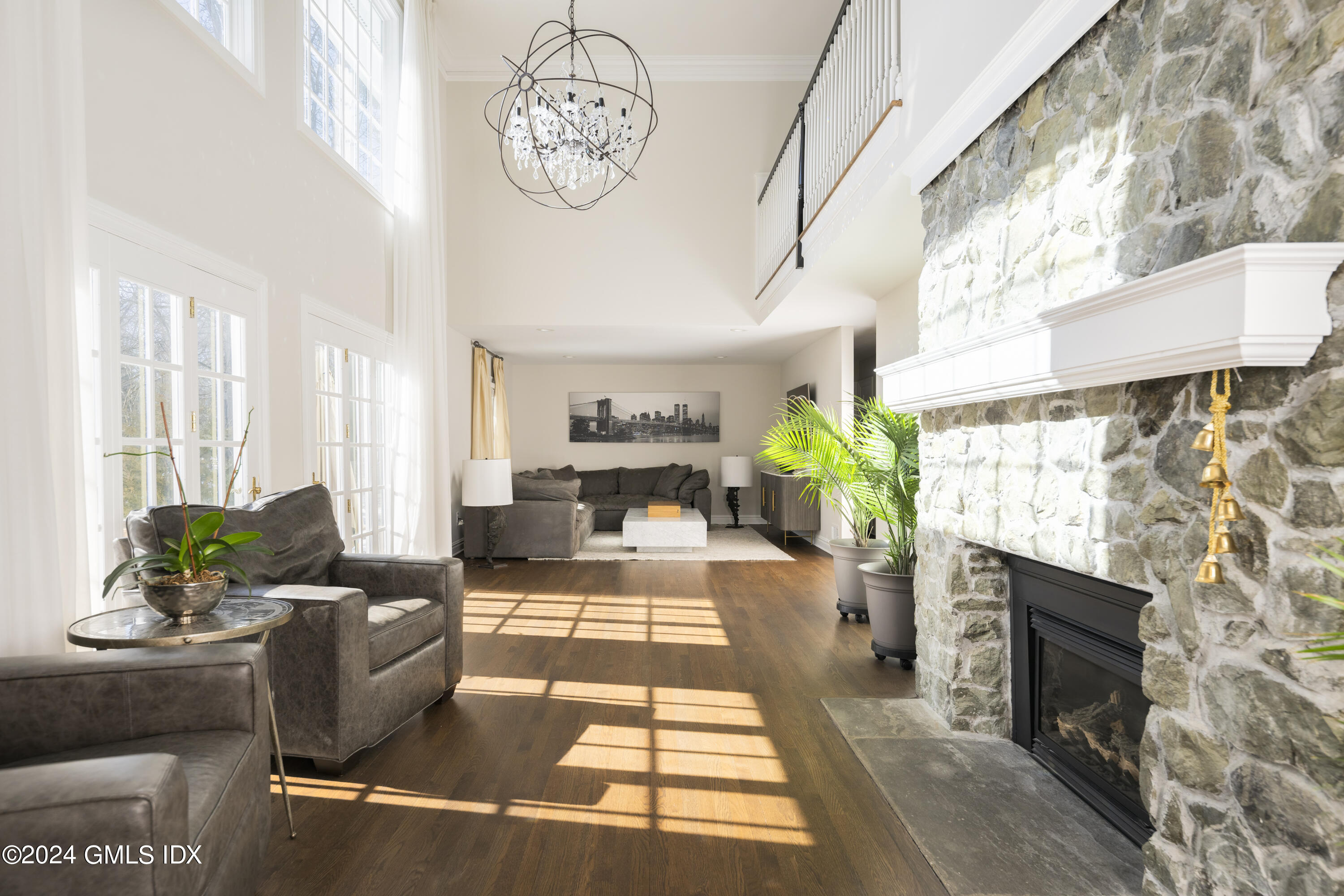 17 Rustic View Road Greenwich, CT 06830 - Photo 4 of 26 a living room with furniture a fireplace and a flat screen tv