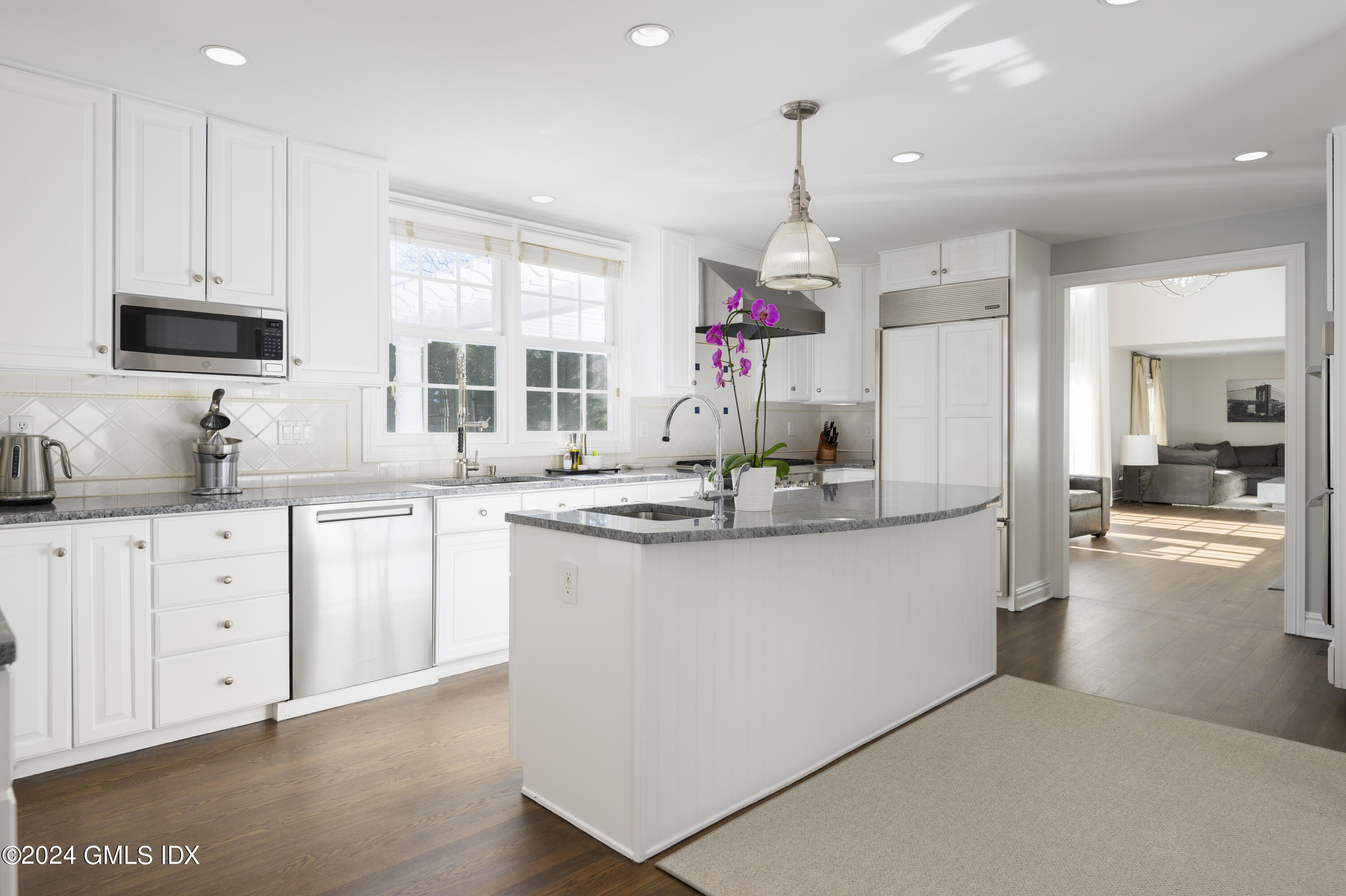 17 Rustic View Road Greenwich, CT 06830 - Photo 6 of 26 a kitchen with granite countertop a sink cabinets and wooden floor