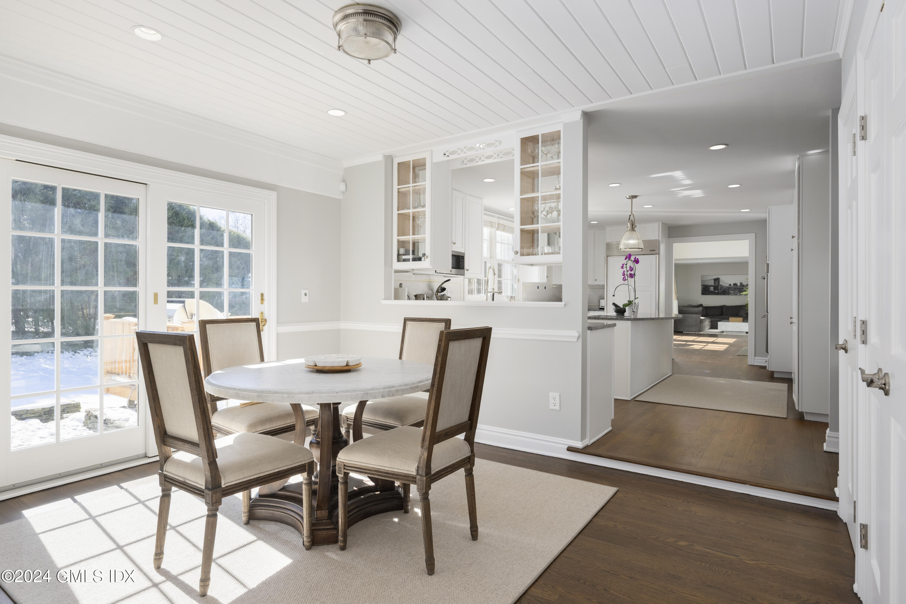 17 Rustic View Road Greenwich, CT 06830 - Photo 8 of 26 a dining room with furniture and a floor to ceiling window