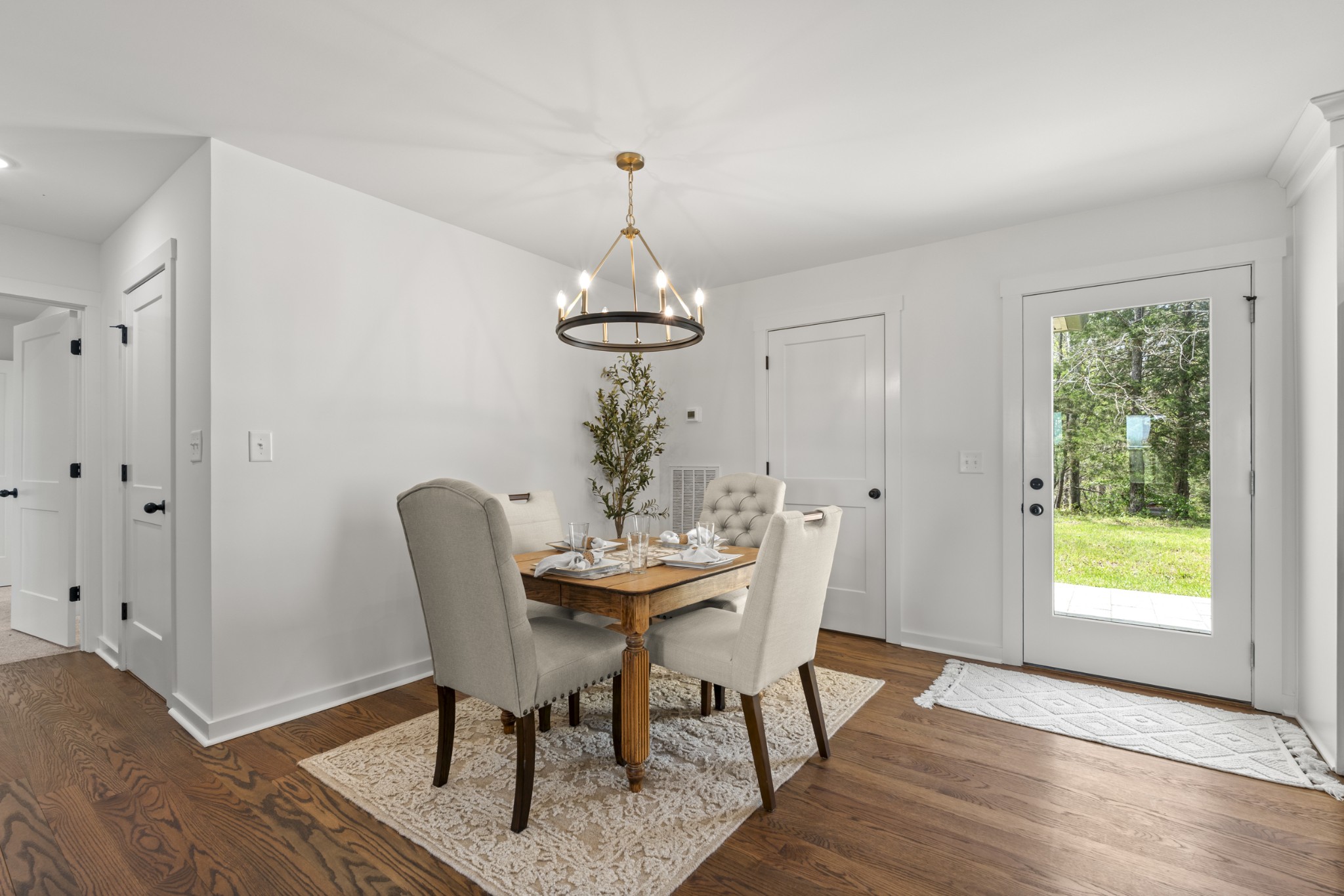 2210 Garners Creek Road Dickson, TN 37055 - Photo 16 of 67 a dining room with furniture a chandelier and wooden floor