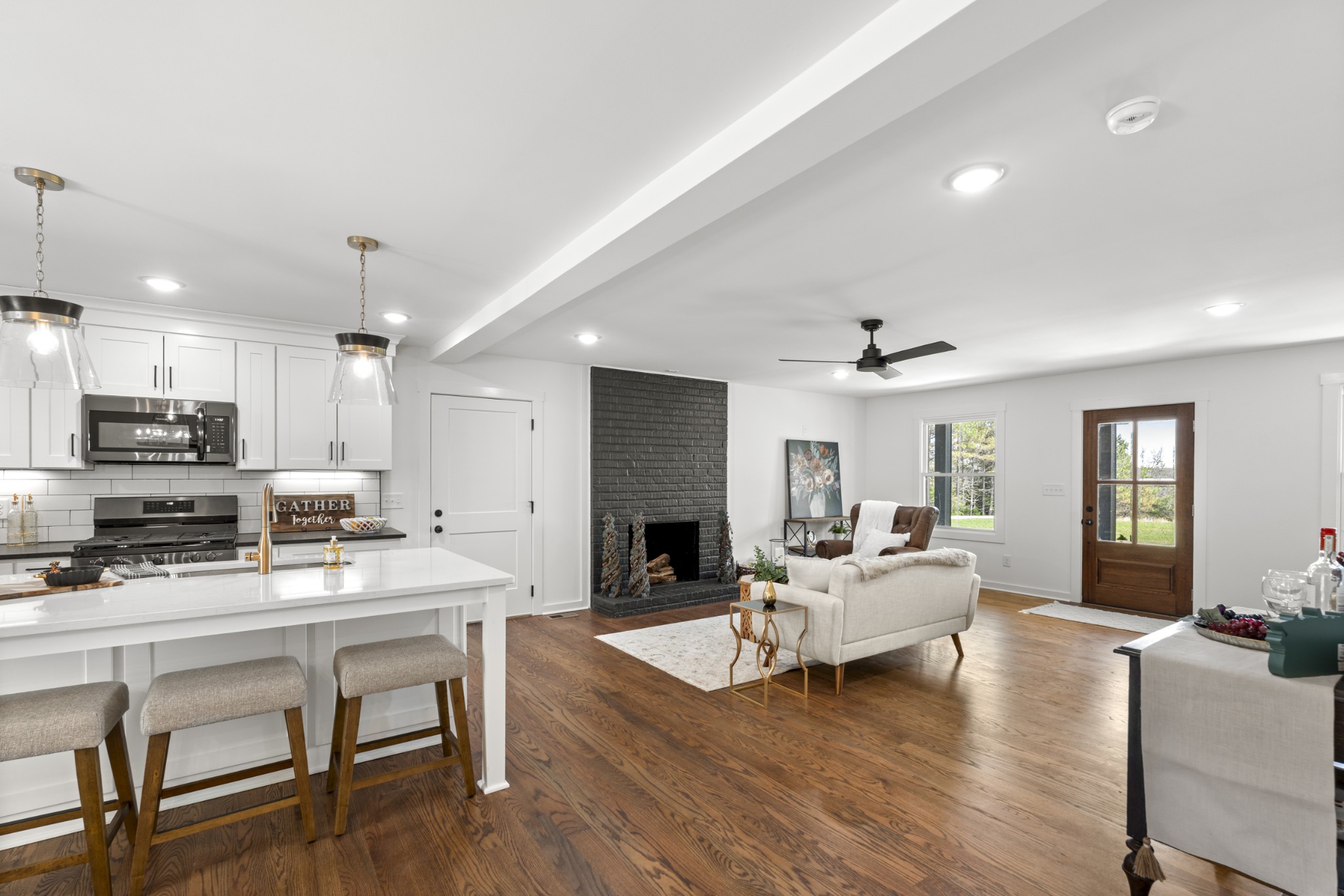 2210 Garners Creek Road Dickson, TN 37055 - Photo 18 of 67 a living room with furniture kitchen view and a fireplace