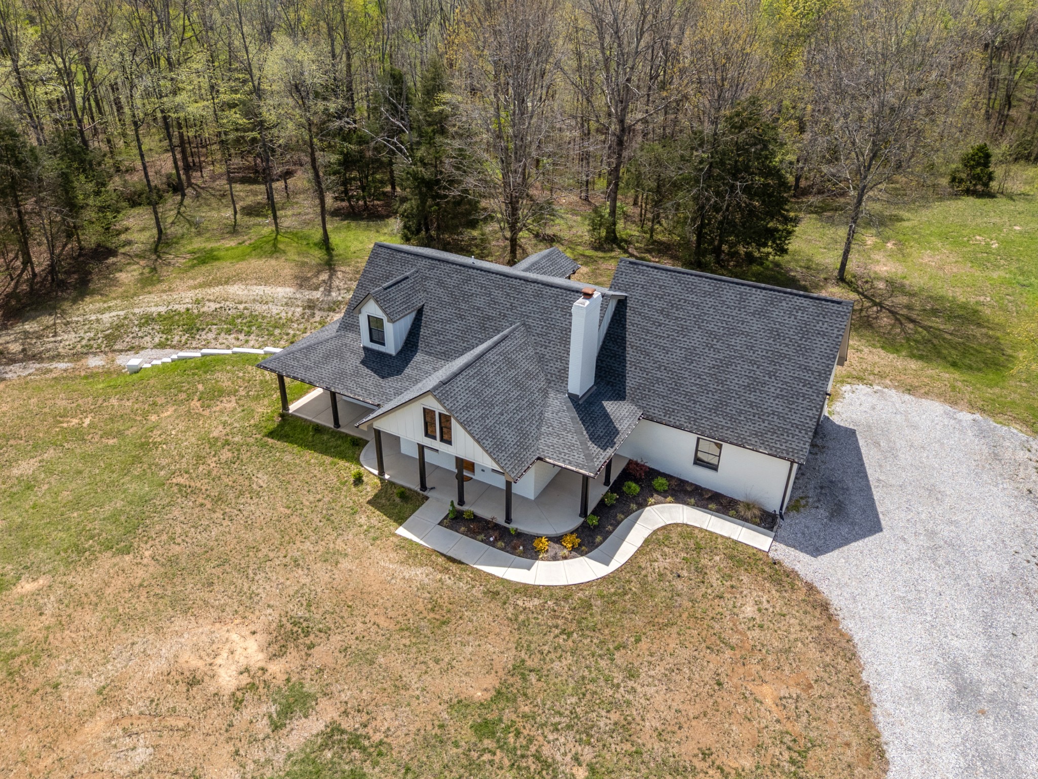 2210 Garners Creek Road Dickson, TN 37055 - Photo 3 of 67 an aerial view of a house with swimming pool and large trees