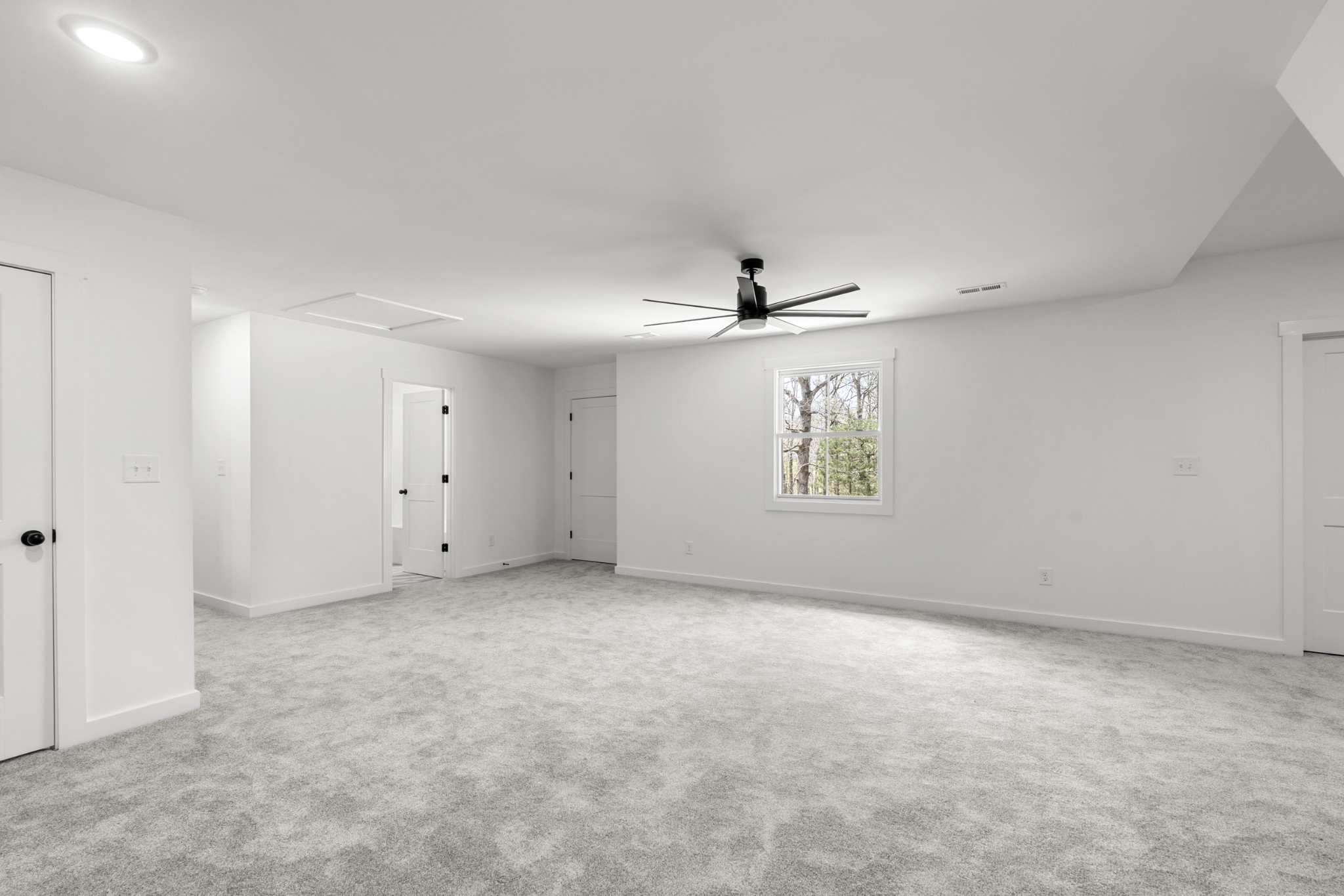 2210 Garners Creek Road Dickson, TN 37055 - Photo 34 of 67 an empty room with windows and fan