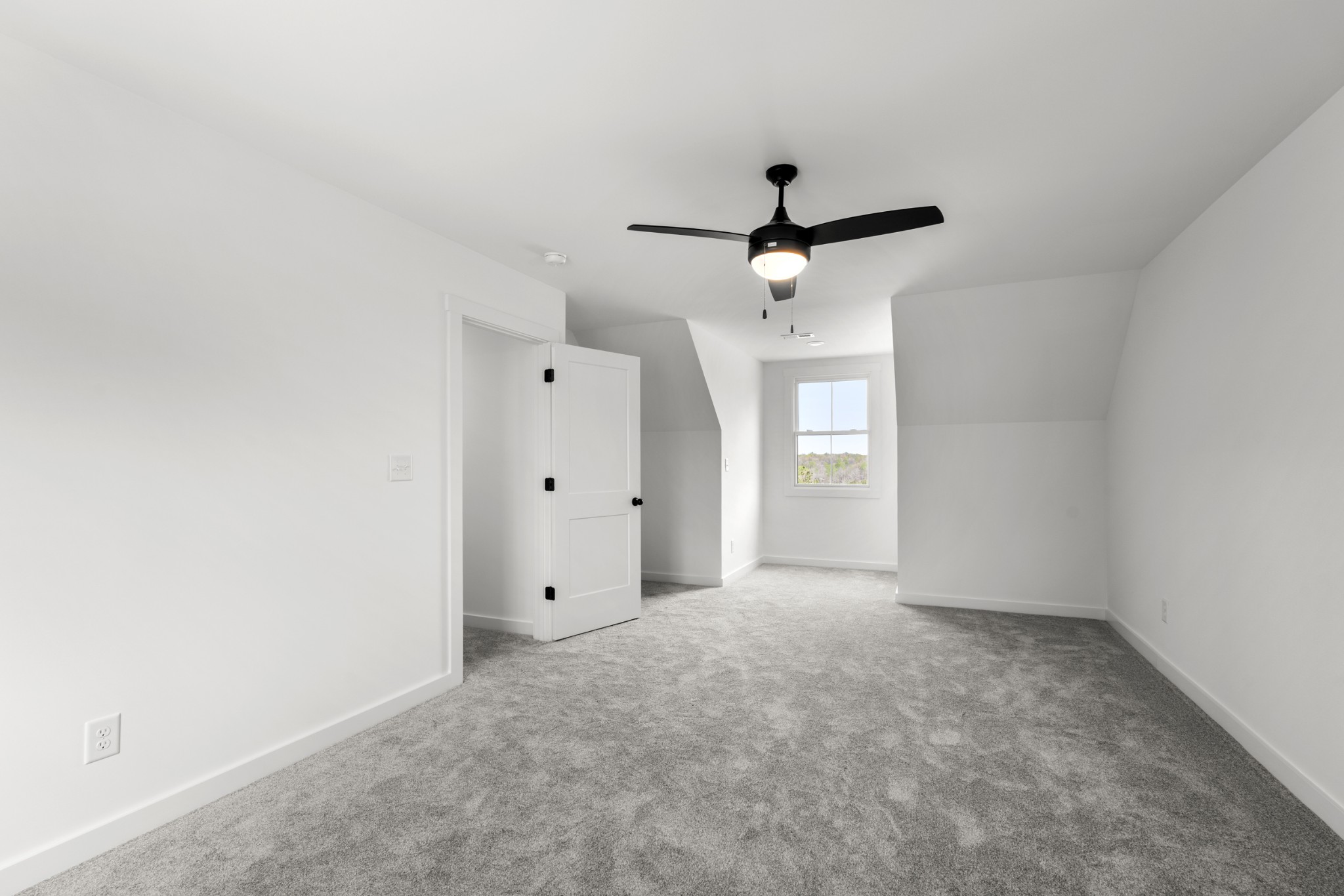 2210 Garners Creek Road Dickson, TN 37055 - Photo 38 of 67 an empty room with a window and a ceiling fan