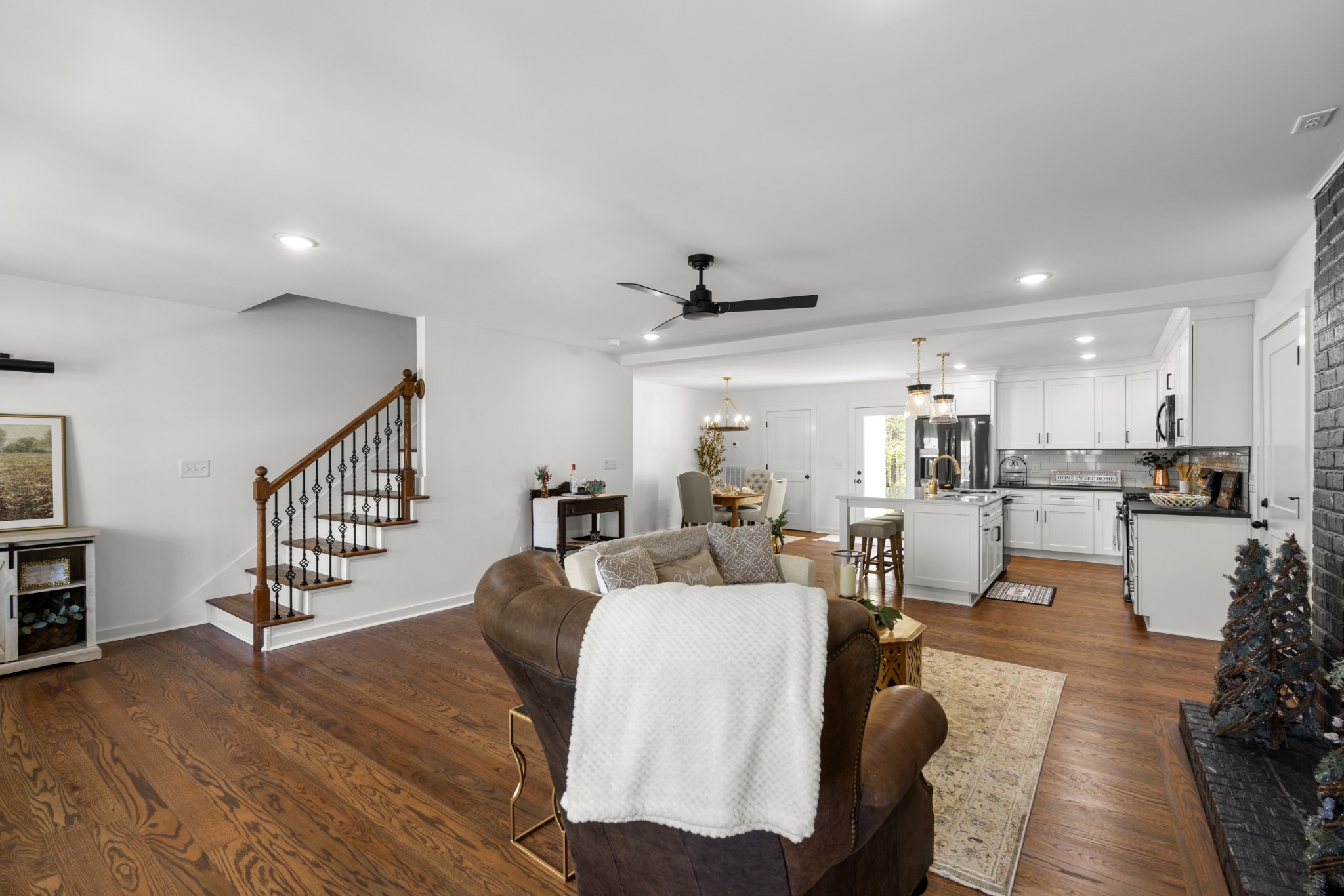 2210 Garners Creek Road Dickson, TN 37055 - Photo 8 of 67 a living room with furniture and a dining table with wooden floor