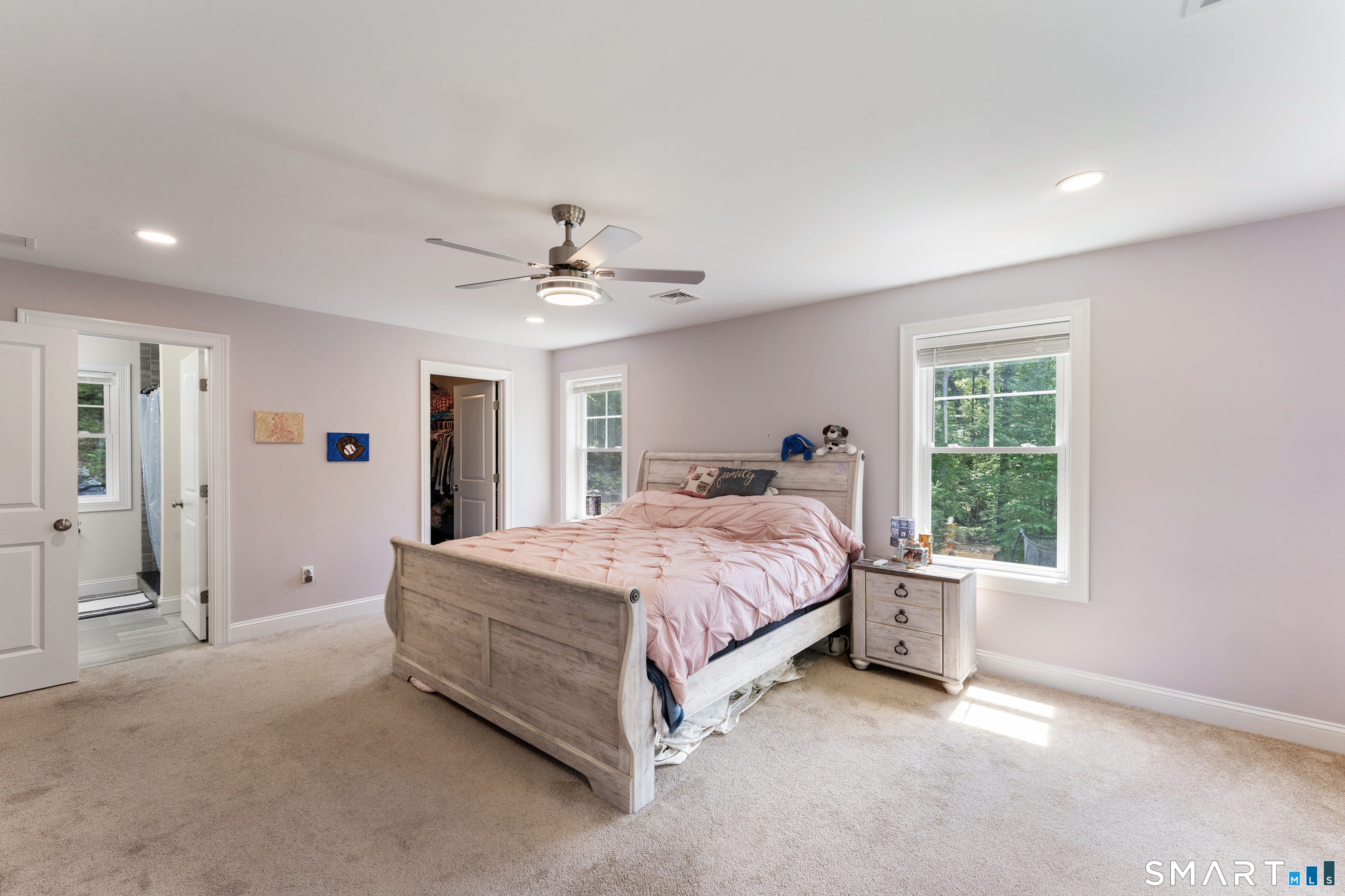 23 Senexet Rd No 1 Woodstock, CT 06281 - Photo 25 of 39 Generous primary bedroom offering abundant natural light, walk-in closet, and en-suite bath