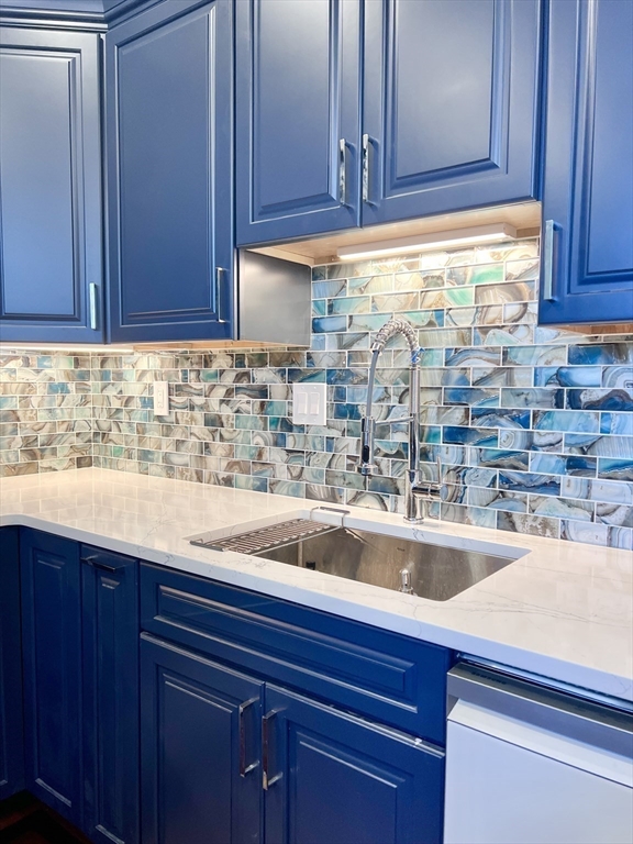 202 Broadway, Unit 33 Lawrence, MA 01840 - Photo 5 of 13 a kitchen with a sink and cabinets