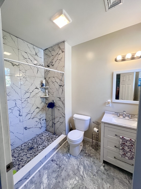 202 Broadway, Unit 33 Lawrence, MA 01840 - Photo 9 of 13 a bathroom with a sink toilet and shower