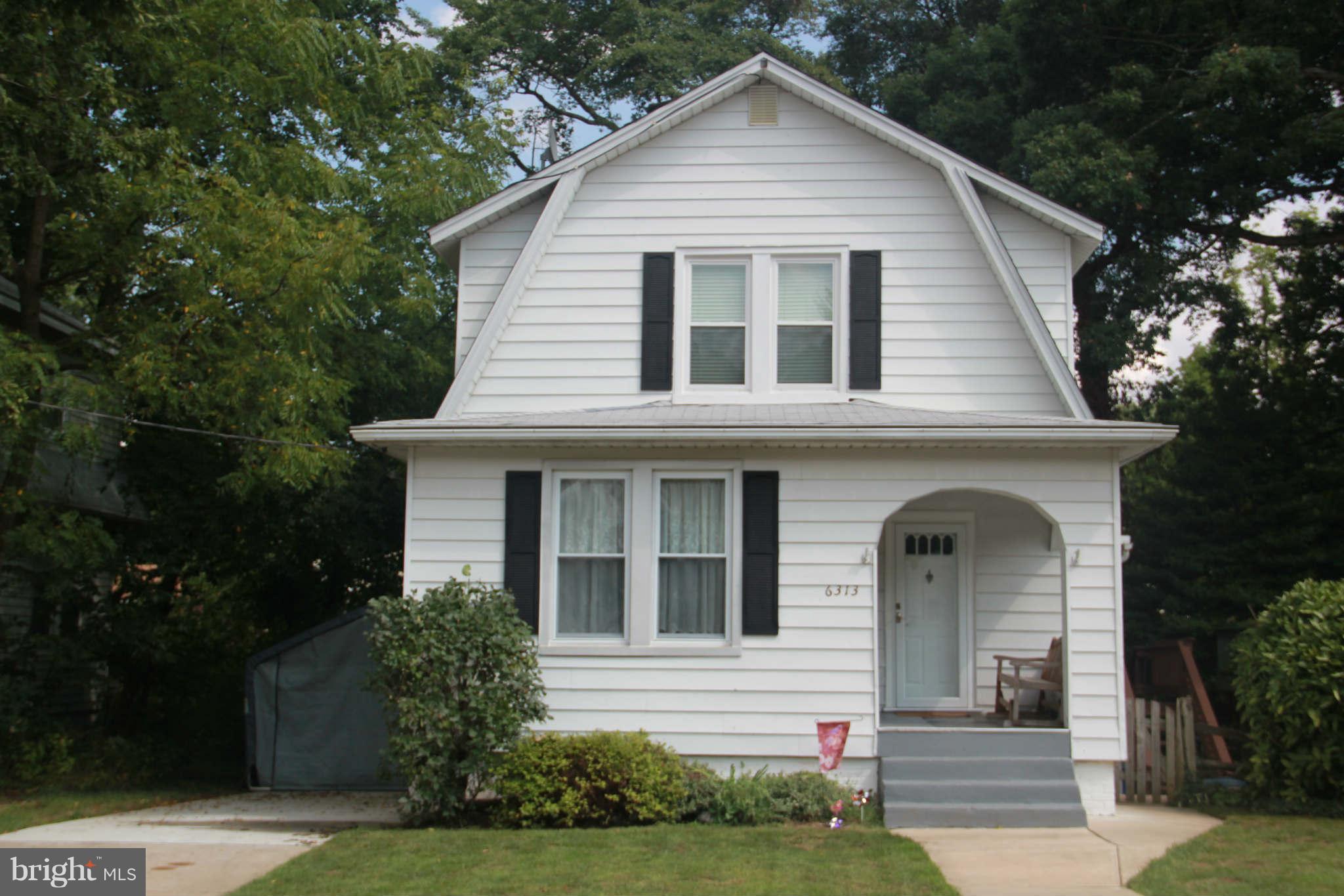 6313 Banbury Road Baltimore, MD 21239 - Photo 1 of 21 a view of front of a white house