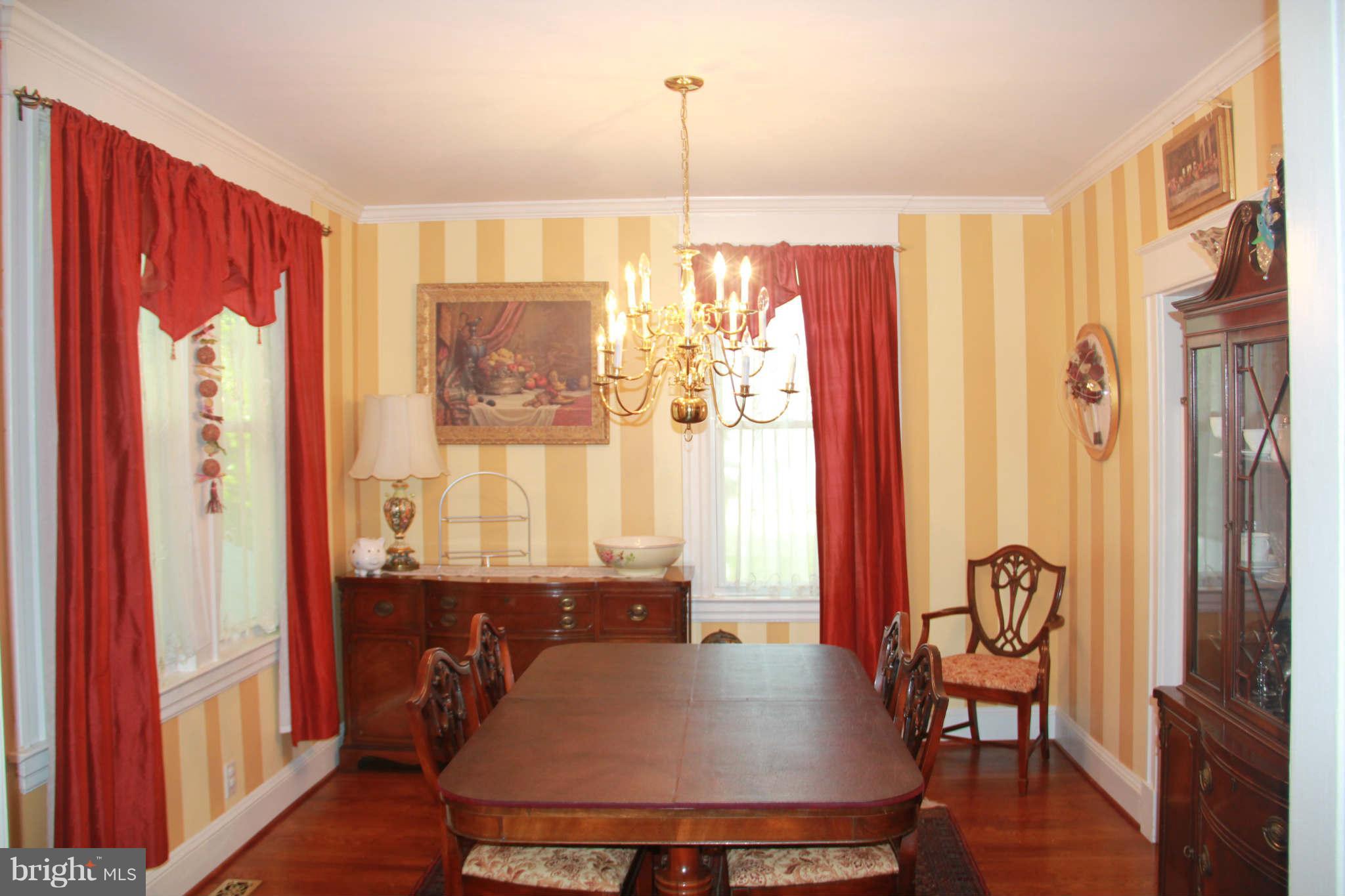 6313 Banbury Road Baltimore, MD 21239 - Photo 11 of 21 a view of a dining room with furniture window and wooden floor