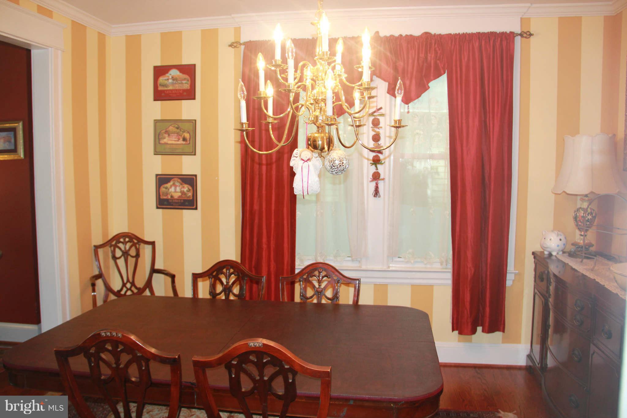 6313 Banbury Road Baltimore, MD 21239 - Photo 12 of 21 a dining room with furniture and wooden floor