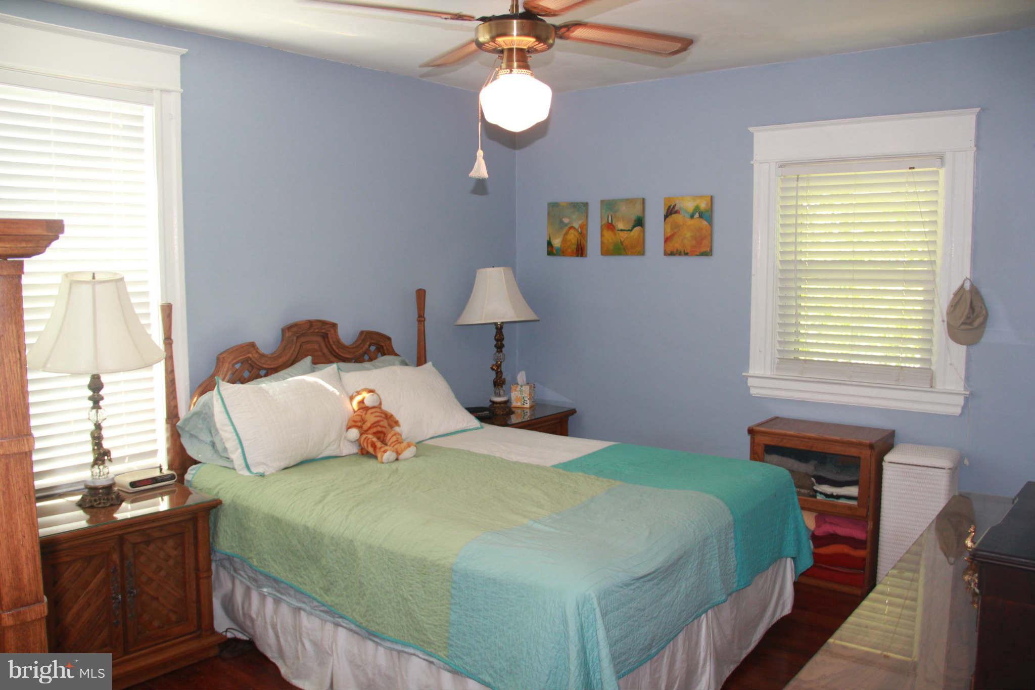 6313 Banbury Road Baltimore, MD 21239 - Photo 17 of 21 a bedroom with a bed and a window