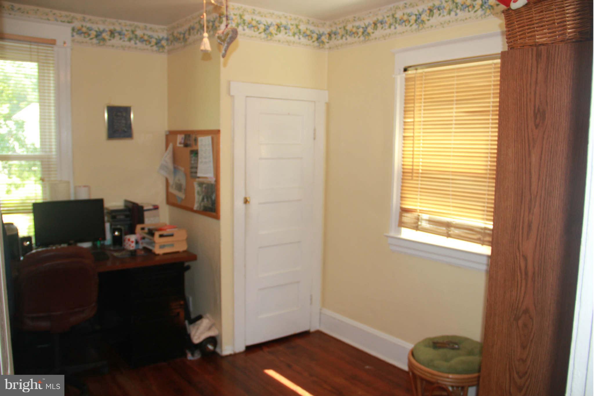 6313 Banbury Road Baltimore, MD 21239 - Photo 18 of 21 a view of a workspace with furniture and a window