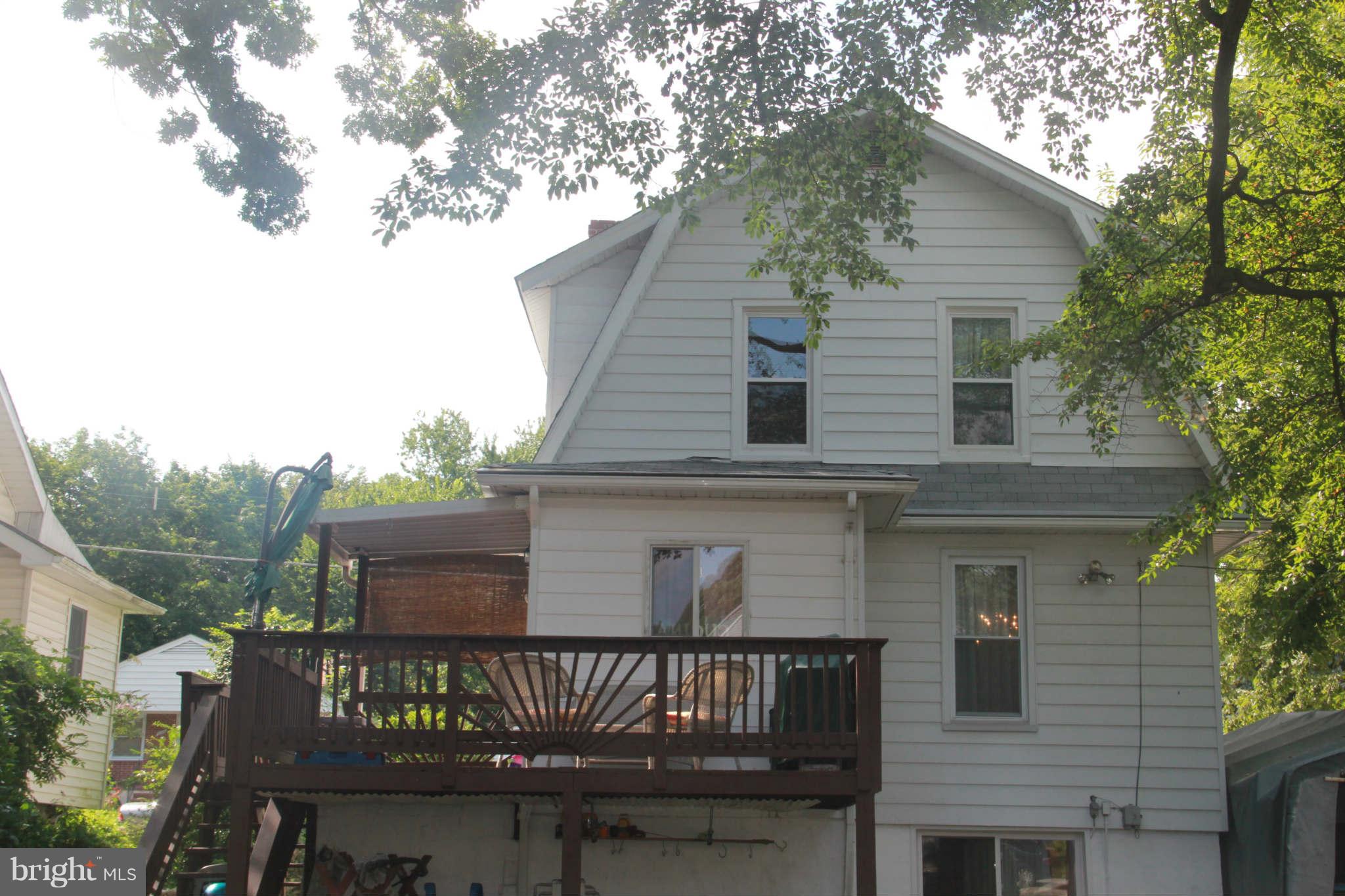 6313 Banbury Road Baltimore, MD 21239 - Photo 3 of 21 a front view of a house with balcony