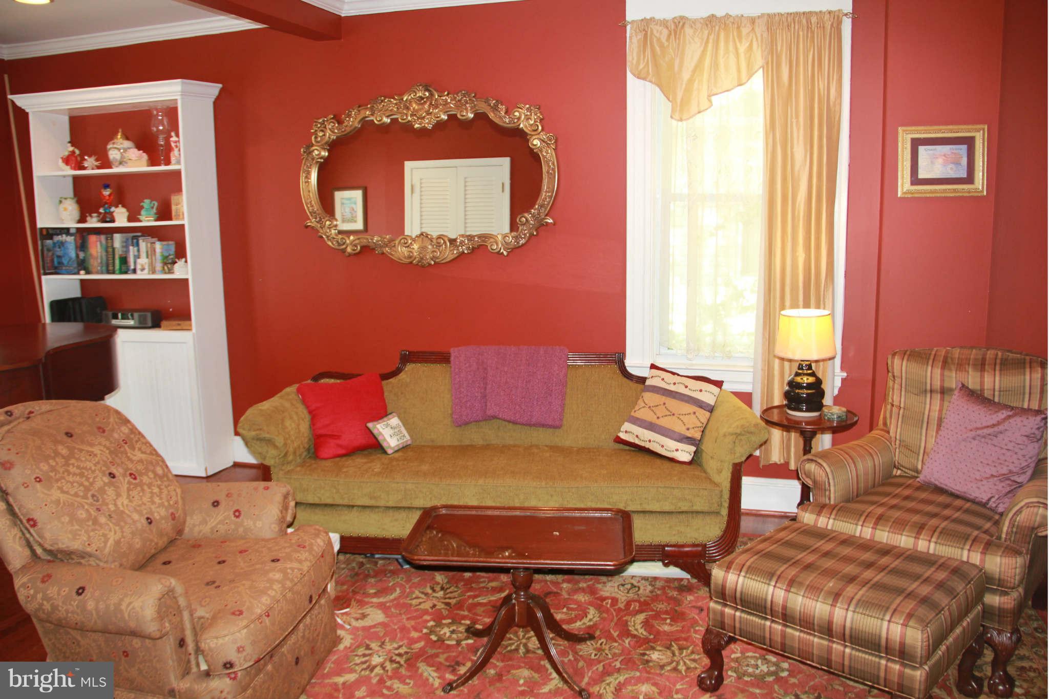 6313 Banbury Road Baltimore, MD 21239 - Photo 8 of 21 a bedroom with furniture and a large window