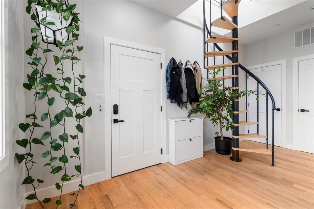 152 Marion Street, Unit 6L Boston, MA 02128 - Photo 11 of 22 a view of an entryway with wooden floor
